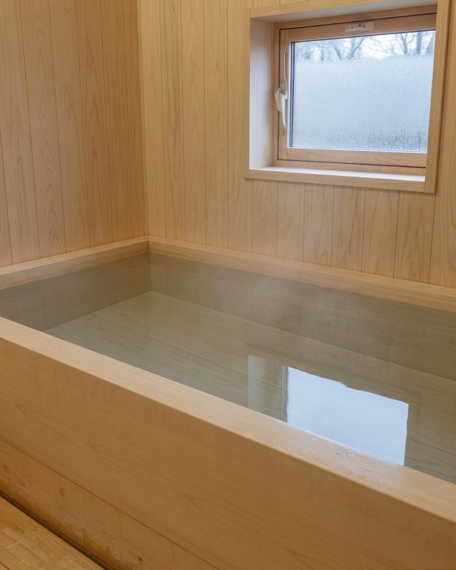 An empty wooden bath